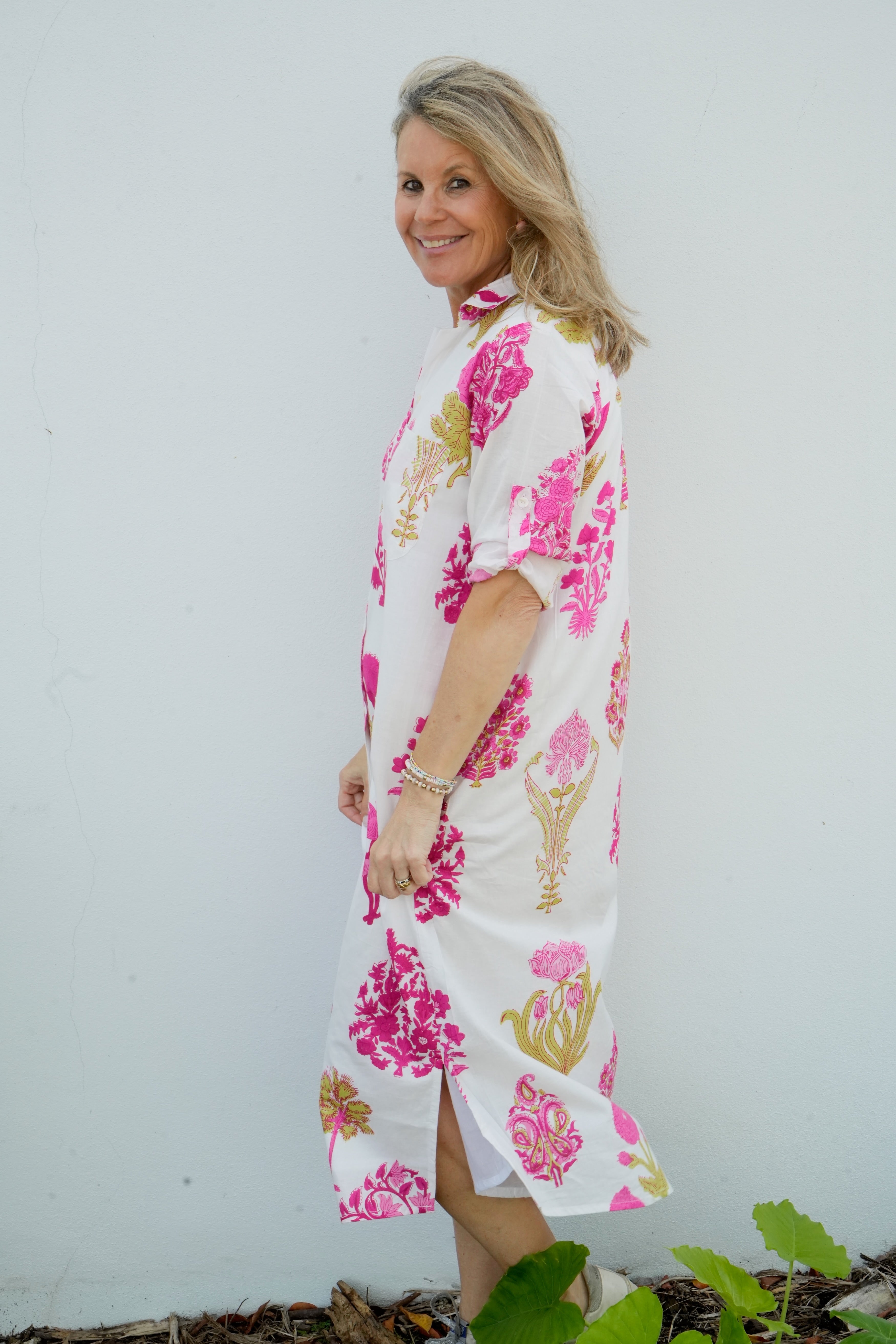 Woman wearing a floral dress with a white background